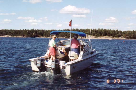 [Photo: Stern quarter view of Boston Whaler 20-Revenge on Small Craft Route]