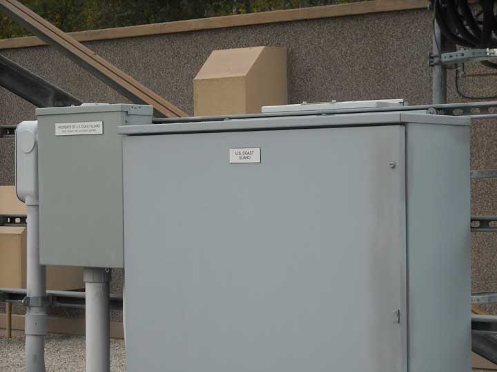 Power distribution cabinet with prominent USCG label.