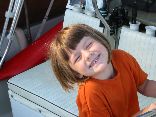 Photo: Young daughter enjoying boating