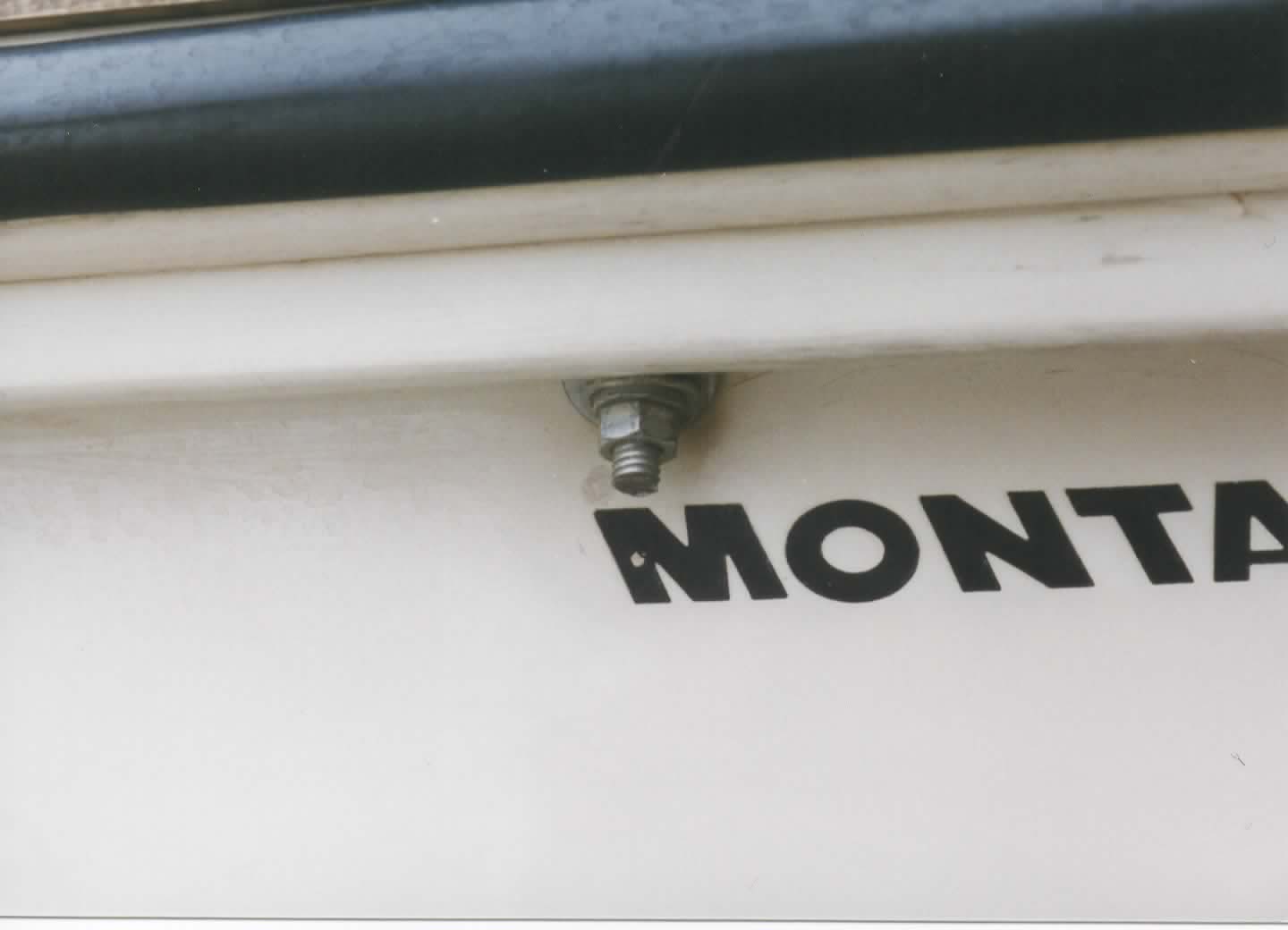 Boston Whaler MONTAUK with added gunwale boards at stern.