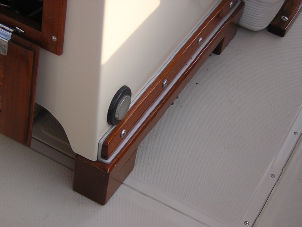 Photo: Boston Whaler center console modified by mounting on wooden risers.