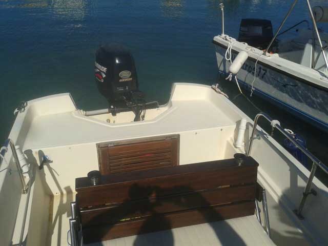 View of stern deck of 17-foot center console boat that resembles a Boston Whaler MONTAUK.