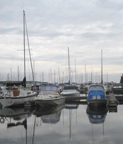 Photo: Bayport Yacht Centre docks with overcast sky and and dead calm.