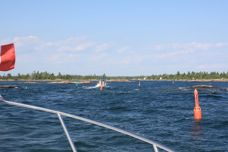 Photo: Narrow buoyed channel leads into shore on Georgian Bay.