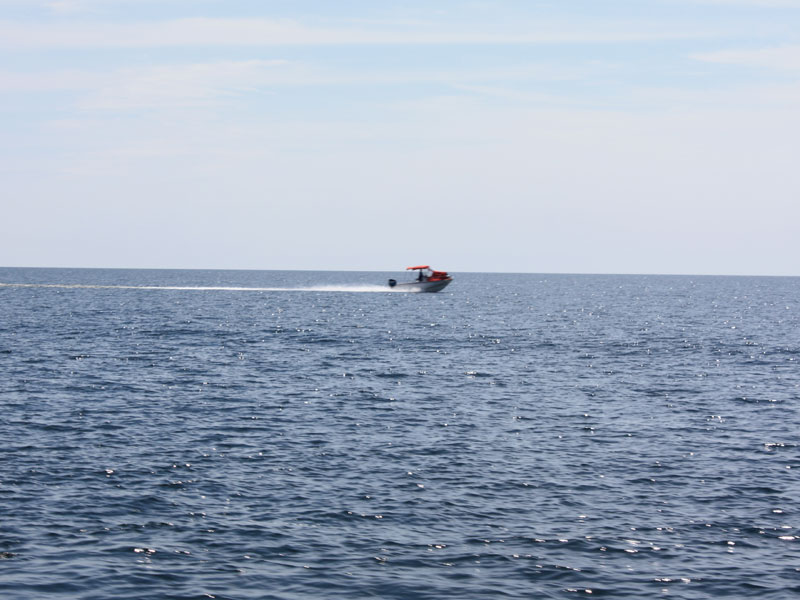 Photo: Boat on plane in open water of Georgian Bay, looking South.