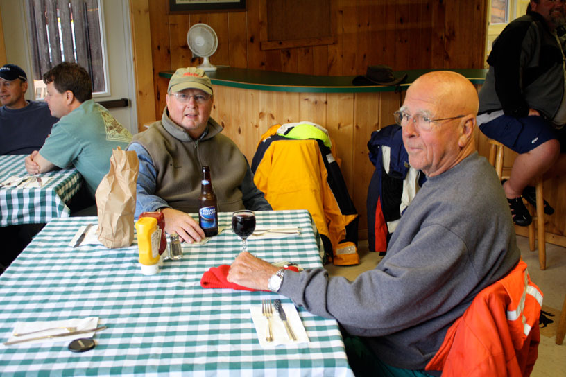 Photo: Pat Henahan and Jack Raby enjoy a cocktail at the Rock Harbor Lodge Grill, Isle Royale, during Lake Superior gale, September 2010.