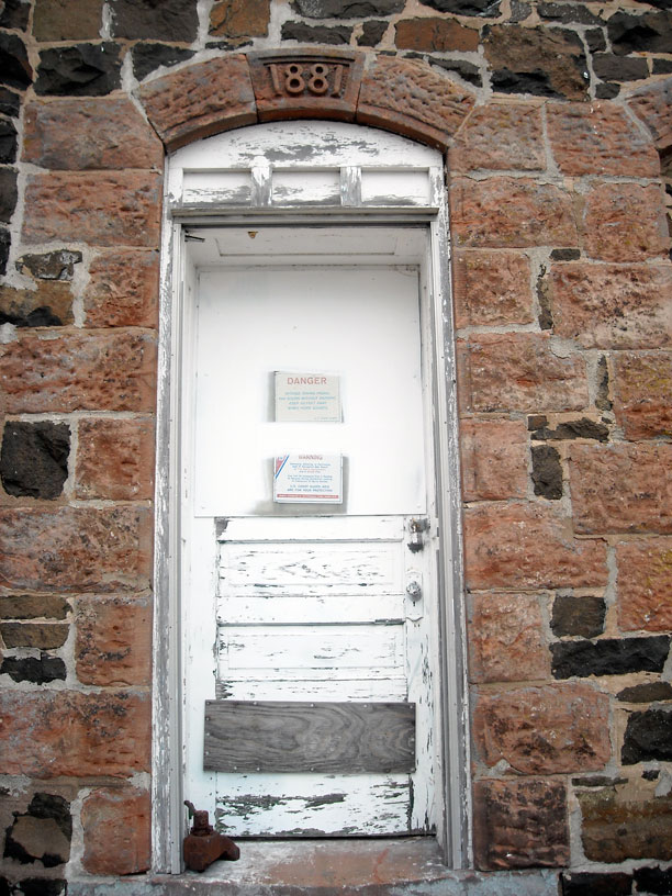 Photo: Stone masonry lighthouse constructed 1881 as seen in door arch.