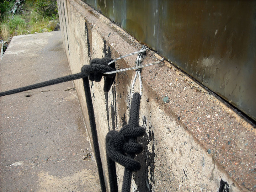Photo: Steel wire rope mooring bights at old boat house in the cove at Passage Island, Lake Superior