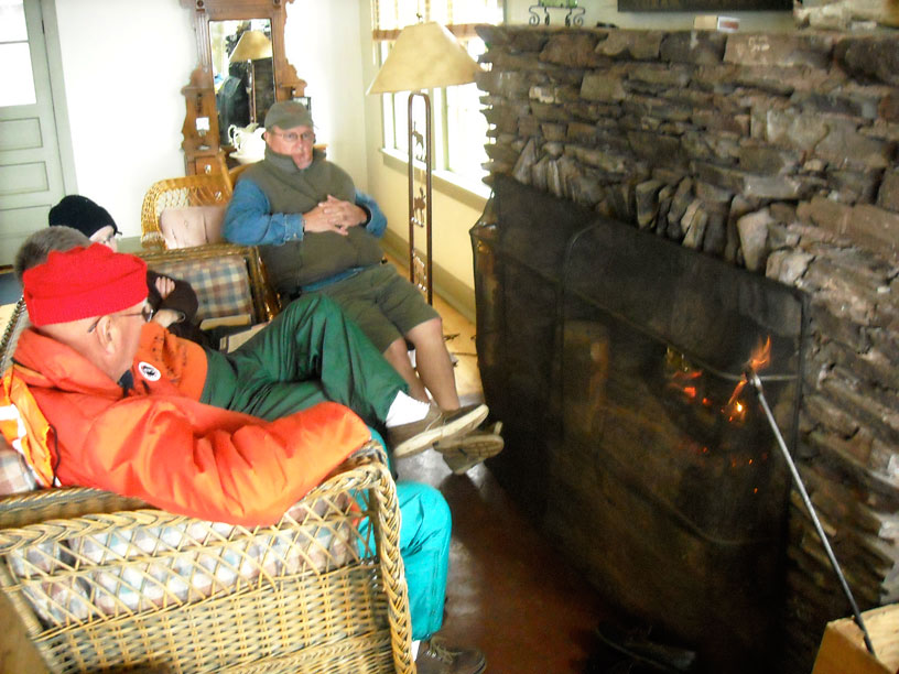 Photo: Boaters warm up around the fireplace at the Hiker's Lounge, Rock Harbor, Isle Royale, Lake Superior