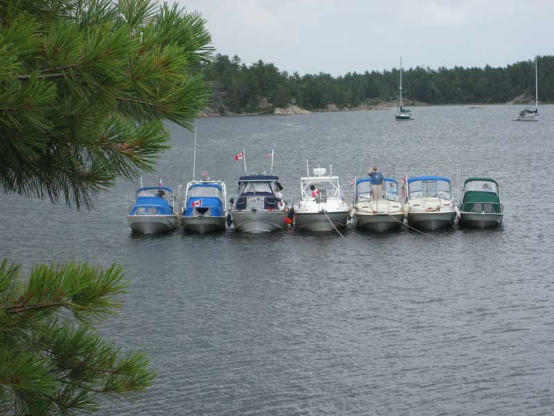 Photo: Seven boats rafted for lunch in Beardrop Harbour, North Channel of Lake Huron.