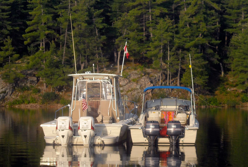 Photo: View of two boats at anchor on very calm water in Marianne Cove, July 2014