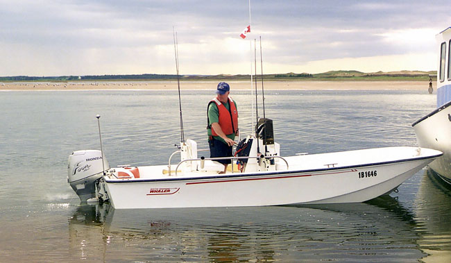 Photo: 1966 16-foot rebuild in water with 45-HP Honda engine