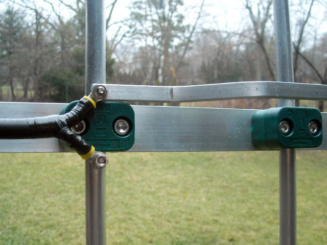 Photo: Close-up of the feedpoint showing loop insulated from boom and fed directly with 50-ohm coaxial cable.