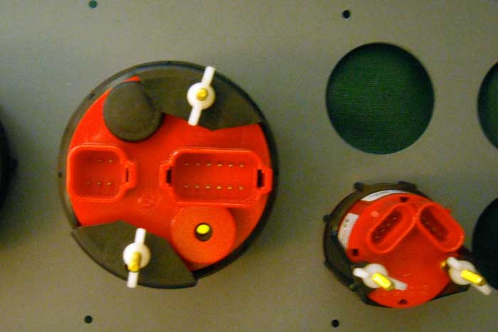 Photo: Rear view of Evinrude ICON gauges showing 6-pin and 12-pin connectors on larger gagues and 4-pin connector on smaller gauges