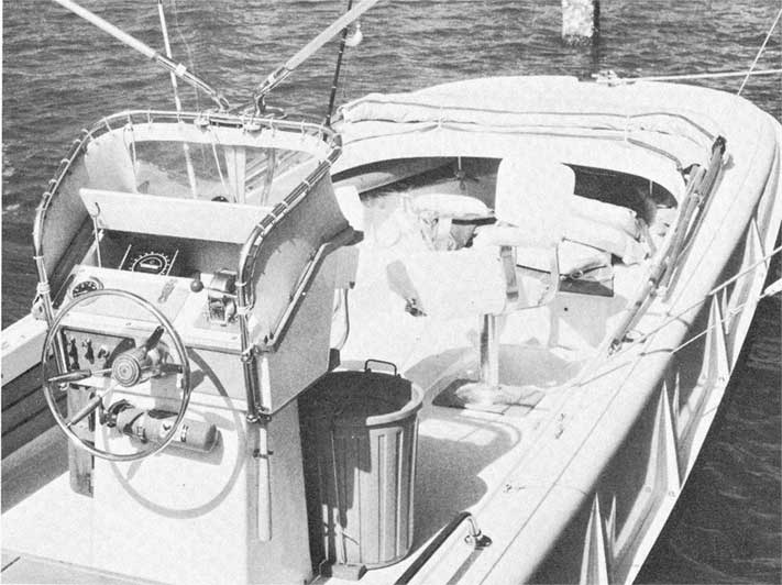 Photo: View of cockpit of Boston Whaler 21-foot Outrage showing console and foredeck.